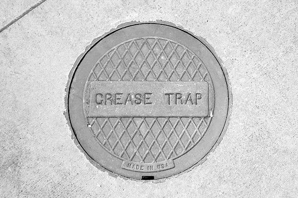 grease trap pumping helps prevent clogs, odors, and backups in your plumbing system
